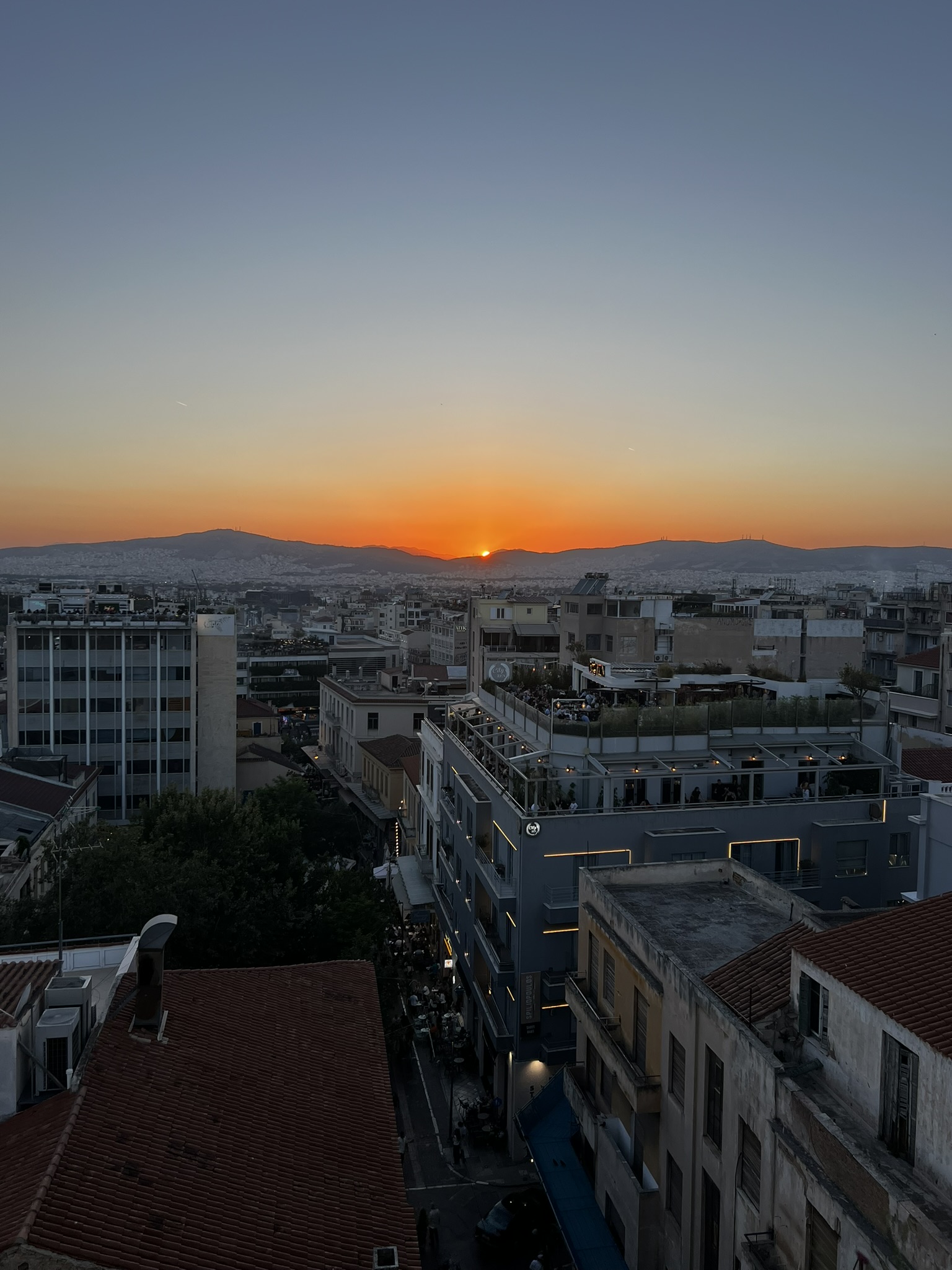 Monastiraki Square in Athens with the Acropolis visible above the historic center.