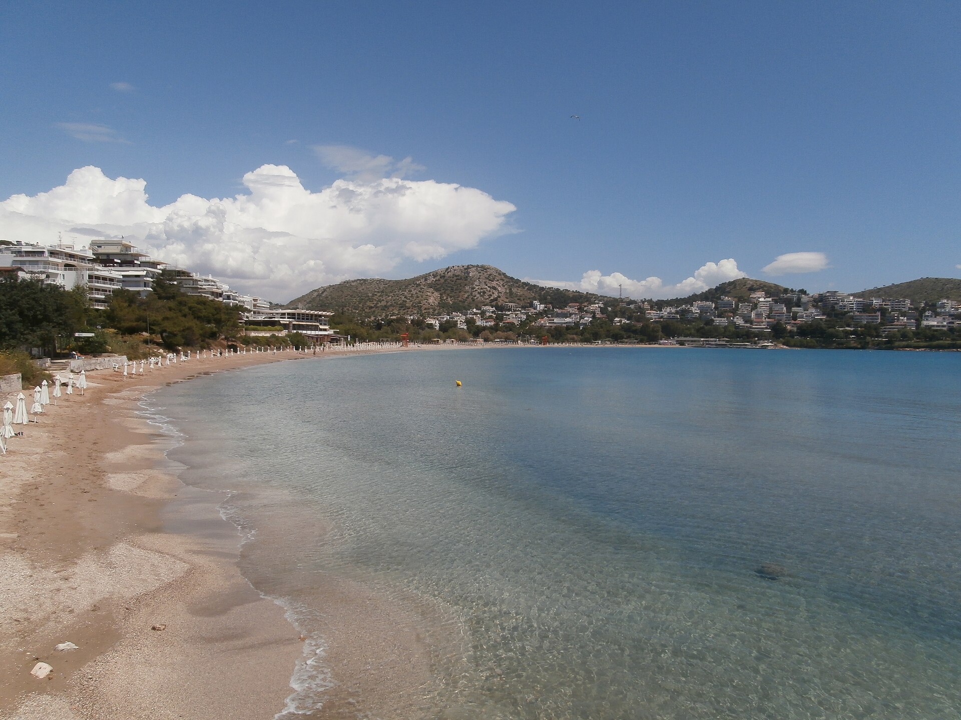 Vouliagmeni beach on the Athens Riviera with calm blue water.